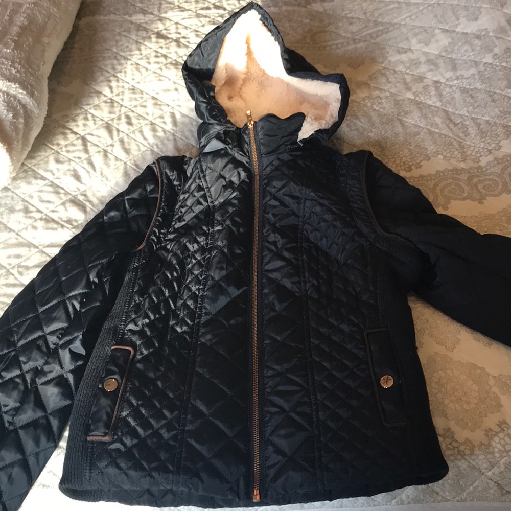 Navy jacket detachable sleeves and hood.